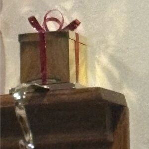 Christmas Stocking Holder      Elegant Gold Gift Box with Red Ribbon